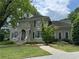 Elegant two-story home with a charming balcony and well-manicured lawn at 2038 Lee Se Rd, Smyrna, GA 30080