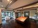 Spacious game room with exposed beams, hardwood floors, and a billiard table at 2038 Lee Se Rd, Smyrna, GA 30080