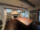 Game room with hardwood floors, exposed ceiling beams, and natural light at 2038 Lee Se Rd, Smyrna, GA 30080