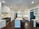 Modern kitchen with marble countertops, stainless steel appliances, and center island at 2038 Lee Se Rd, Smyrna, GA 30080