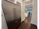 Stainless steel refrigerator and view into the kitchen with an island and eat in kitchen at 2038 Lee Se Rd, Smyrna, GA 30080