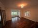 Bright living room with gleaming hardwood floors and large windows bringing in natural light at 2038 Lee Se Rd, Smyrna, GA 30080