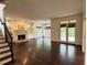 Spacious living room with a fireplace, wood floors, built-in shelving, and natural light at 2038 Lee Se Rd, Smyrna, GA 30080