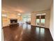 Spacious living room with hardwood floors, a fireplace, built-in shelving, and outdoor access at 2038 Lee Se Rd, Smyrna, GA 30080