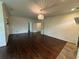Large living room with hardwood flooring, classic chandelier, and open doorways at 2038 Lee Se Rd, Smyrna, GA 30080