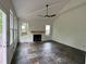 Bright living room with a fireplace, vaulted ceiling, large windows, and slate flooring at 2038 Lee Se Rd, Smyrna, GA 30080