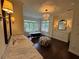 Luxurious main bathroom featuring marble countertops, a soaking tub, and a chandelier at 2038 Lee Se Rd, Smyrna, GA 30080