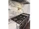Close up of the stainless steel range with marble countertops at 2038 Lee Se Rd, Smyrna, GA 30080