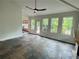 Sunroom featuring slate flooring, a fireplace, and lots of natural light from large windows at 2038 Lee Se Rd, Smyrna, GA 30080