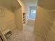 Spacious walk-in closet area with wire shelving, white walls, and hexagon tile flooring at 2038 Lee Se Rd, Smyrna, GA 30080