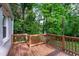 Spacious wooden deck overlooking lush backyard with plenty of tree coverage at 2599 E Tupelo Se St, Atlanta, GA 30317