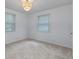Clean bedroom with neutral carpeting and two windows providing natural light at 2599 E Tupelo Se St, Atlanta, GA 30317