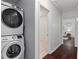 Convenient laundry area with washer and dryer next to hallway and bedroom at 2599 E Tupelo Se St, Atlanta, GA 30317