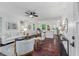 Open concept living space with hardwood floors, modern decor, and seamless flow to kitchen at 2599 E Tupelo Se St, Atlanta, GA 30317