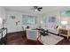 Inviting living room featuring dark hardwood floors, a neutral color palette, and a stylish rug at 2599 E Tupelo Se St, Atlanta, GA 30317