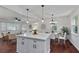 Bright, open-concept living room and dining area with hardwood floors and modern lighting at 2599 E Tupelo Se St, Atlanta, GA 30317