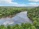 Aerial view features a serene river flowing amidst lush greenery, providing a tranquil and scenic backdrop at 3846 Chattahoochee Summit Se Dr # 31, Atlanta, GA 30339