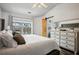 Bright bedroom featuring a king bed, dresser, and an abundance of natural light at 3846 Chattahoochee Summit Se Dr # 31, Atlanta, GA 30339