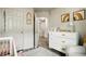 Bedroom featuring a white dresser, rainbow art, and a cozy chair at 3846 Chattahoochee Summit Se Dr # 31, Atlanta, GA 30339