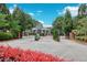 Beautiful gated community entrance with lush landscaping and manicured greenery for a welcoming feel at 3846 Chattahoochee Summit Se Dr # 31, Atlanta, GA 30339