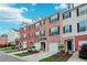 Well-kept townhomes with brick and vinyl exteriors, each featuring an attached garage and landscaped front gardens at 3846 Chattahoochee Summit Se Dr # 31, Atlanta, GA 30339