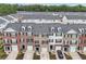 Charming townhomes featuring brick facades, well-kept landscaping, and attached garages for modern suburban living at 3846 Chattahoochee Summit Se Dr # 31, Atlanta, GA 30339