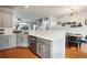 Open kitchen with stainless steel appliances, white countertop, and hardwood floors at 3846 Chattahoochee Summit Se Dr # 31, Atlanta, GA 30339