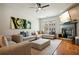 Inviting living room with hardwood floors, fireplace, large sectional sofa, and stylish decor at 3846 Chattahoochee Summit Se Dr # 31, Atlanta, GA 30339