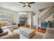 Comfortable living room with a stone fireplace, hardwood floors, and a sectional sofa facing a flat screen television at 3846 Chattahoochee Summit Se Dr # 31, Atlanta, GA 30339