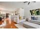 Open-concept living area featuring hardwood floors and comfortable seating, next to a sleek modern kitchen at 3846 Chattahoochee Summit Se Dr # 31, Atlanta, GA 30339