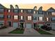 Charming townhomes featuring brick facades, private garages, and well-maintained landscaping during sunset at 3846 Chattahoochee Summit Se Dr # 31, Atlanta, GA 30339