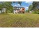 Spacious backyard with lush lawn features a large two story deck with stairs at 470 Brackin Trce, Grayson, GA 30017