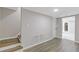 Finished basement with wooden-look floors and a walk out door at 470 Brackin Trce, Grayson, GA 30017