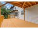 Large wood deck with views of the house and surrounding greenery at 470 Brackin Trce, Grayson, GA 30017