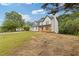 Side view of a two-story house with a covered front porch and well-maintained lawn at 470 Brackin Trce, Grayson, GA 30017
