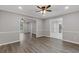 Open-concept living area with modern floors, recessed lighting, and seamless transitions to other rooms at 470 Brackin Trce, Grayson, GA 30017