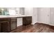 Bathroom featuring double vanity sinks with dark wood cabinets and sleek hardware at 113 Expedition Dr, Ellenwood, GA 30294
