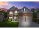 Charming brick home with a well-manicured lawn, two car garage, and a cozy front porch at 113 Expedition Dr, Ellenwood, GA 30294