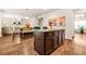 Spacious kitchen with a center island, granite countertops, and an open layout to the living area at 113 Expedition Dr, Ellenwood, GA 30294