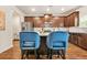 Kitchen with stainless steel appliances, stylish island with seating, and ample cabinet space at 113 Expedition Dr, Ellenwood, GA 30294