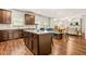 Open concept kitchen with granite countertops, stainless appliances, and a center island at 113 Expedition Dr, Ellenwood, GA 30294