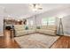 Spacious living area with open kitchen view, featuring hardwood floors and natural light at 113 Expedition Dr, Ellenwood, GA 30294