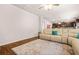 Open living space with hardwood floors, open to the kitchen, and comfortable seating at 113 Expedition Dr, Ellenwood, GA 30294