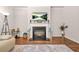 Cozy living room with fireplace, large television, decor and open space at 113 Expedition Dr, Ellenwood, GA 30294