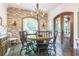 Charming dining room features a brick accent wall, wood floors and plenty of light at 3938 Hillsman Ln, Marietta, GA 30062