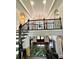 Elegant foyer with staircase and wrought iron railing provides an open view to rooms below at 3938 Hillsman Ln, Marietta, GA 30062