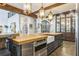 Gorgeous kitchen with stainless appliances, custom cabinets, farm sink and wood countertops at 3938 Hillsman Ln, Marietta, GA 30062