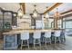 Spacious kitchen featuring a large island with seating, wood beams, and pendant lighting at 3938 Hillsman Ln, Marietta, GA 30062
