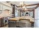 Well-appointed kitchen features an island, stainless steel appliances, and pendant lighting, creating a functional space at 3938 Hillsman Ln, Marietta, GA 30062