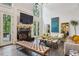 Bright living room with soaring ceilings, fireplace, and access to outdoor space at 3938 Hillsman Ln, Marietta, GA 30062